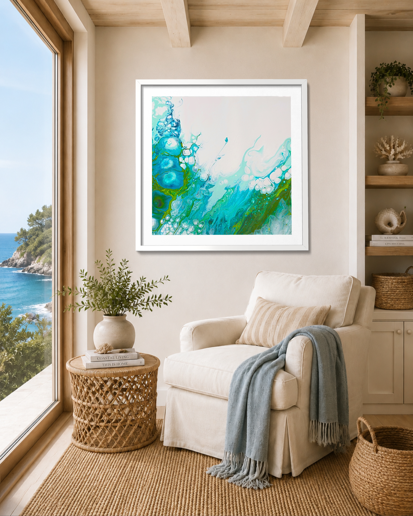 A framed abstract art print featuring vibrant turquoise, teal, and green fluid swirls on a light cream background, styled in a bright, modern living room above a beige armchair.